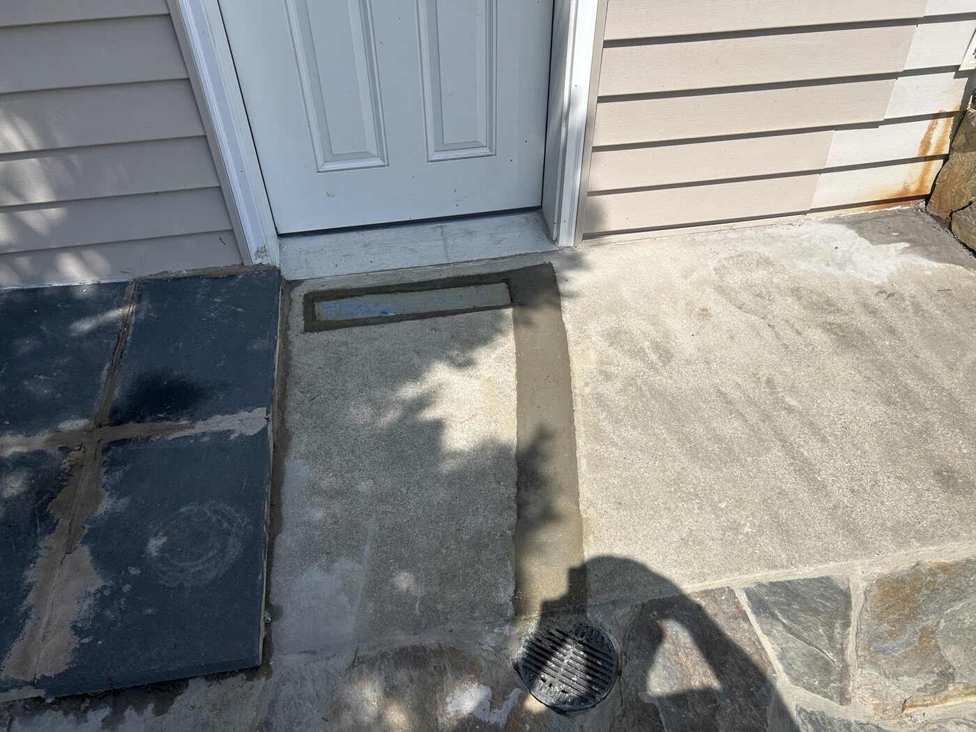 Completed doorway drainage and concrete repair